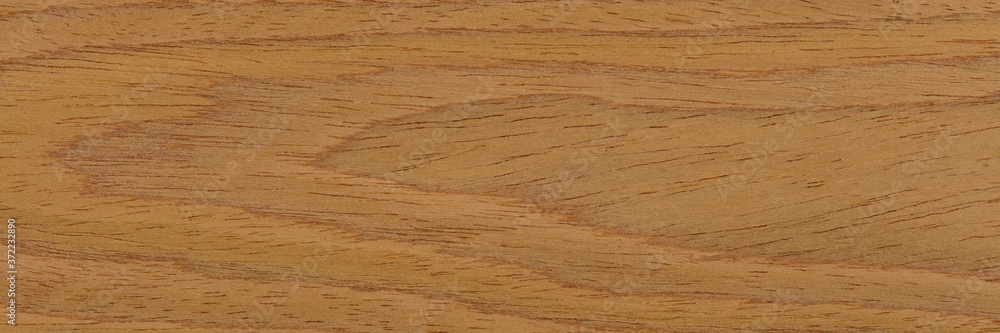 New natural brown oak veneer background for stylish interior. Natural wood texture, pattern of a long veneer sheet. New natural brown oak veneer background for stylish interior. Natural wood texture, pattern of a long veneer sheet.