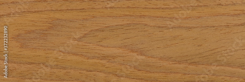 New natural brown oak veneer background for stylish interior. Natural wood texture, pattern of a long veneer sheet.