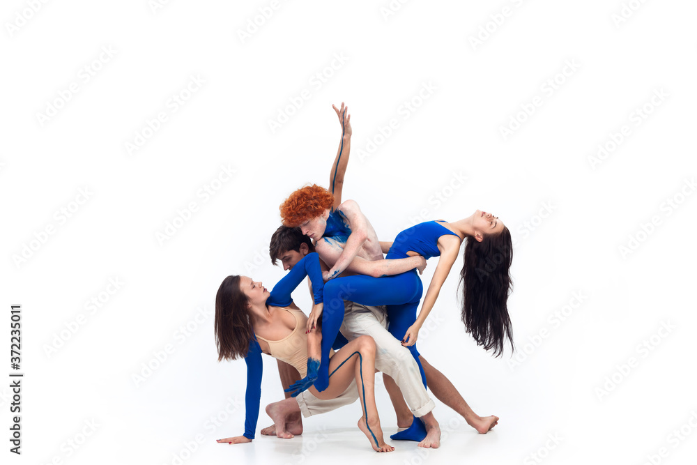 Line. Group of modern dancers, art contemp dance, blue and white combination of emotions. Flexibility and grace in motion and action on white studio background. Fashion and beauty, artwork concept.