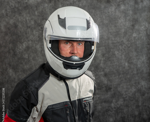 portrait of senior biker with helmet © Philipimage