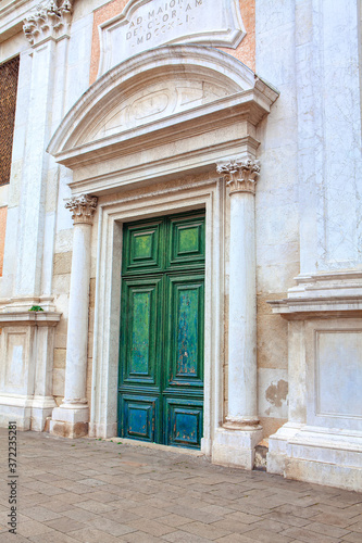 Entrance of Catholic Church with Green Wooden Door 