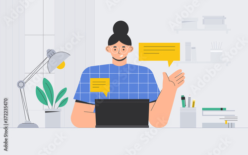 Young woman with glasses sits at a laptop and communicates on social networks. Freelancer sits at a Desk and uses a laptop in a cozy room. Flat  illustration in modern style, lineart.