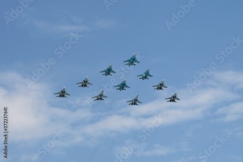 Tactical wing consisting of a group of su-30SM and su-35S fighters and SU-34 bombers in the sky over Moscow during the dress rehearsal of the Victory parade