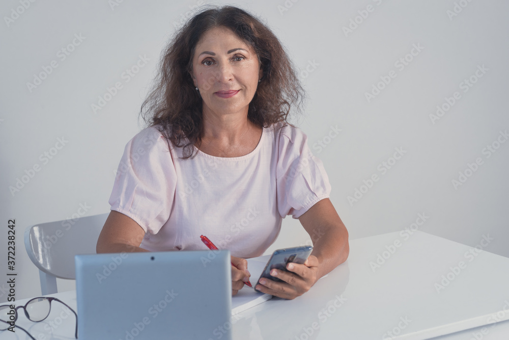 Portrait of a beautiful senior woman working at home