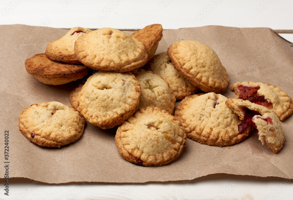 homemade round baked cookies on brown paper, delicious dessert homemade round baked cookies on brown paper, delicious dessert