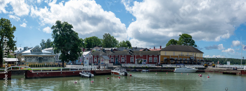 The harbour and waterfront of Naantali town in south-west Finland during a sunny summer day. The medieval stone church was built in 1480.