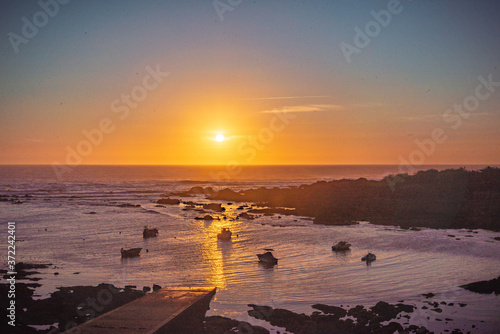 Puesta de sol en la costa gallega España photo