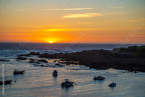 Puesta de sol en la costa gallega España photo