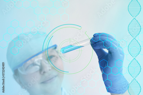 female pharmacist, scientist holding a glass test tube with medicine, vaccine, modern science innovation concept, medical development for the treatment of coronavirus, COVID-19, dna test photo