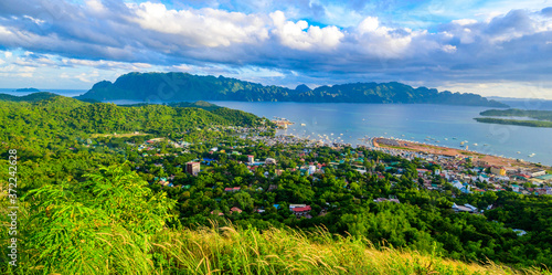 View of Coron Town and Bay from Mount Tapyas on Busuanga Island at sunset - tropical destination with paradise landscape scenery, Palawan, Philippines. photo