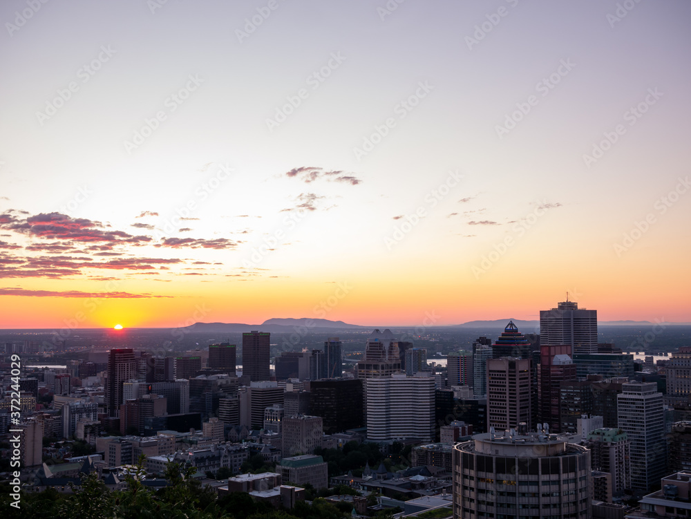 Fototapeta premium Montreal sunrise viewed from Mount Royal with city skyline in the morning