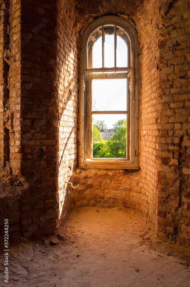 Window overlooking the garden and the house in the old estate