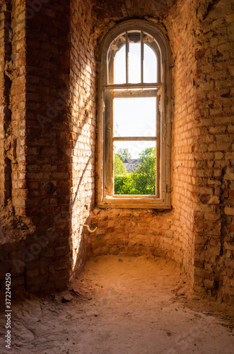 Window overlooking the garden and the house in the old estate