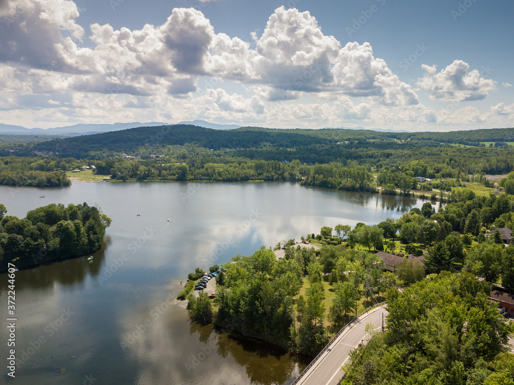 View of a little town, lake and river from the sky. Cowansville, Quebec, Canada