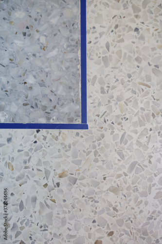 Gray terrazzo floor with separate line. Interior texture background and construction concept. Vertical.