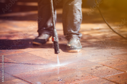 Outdoor floor cleaning with high pressure water jet