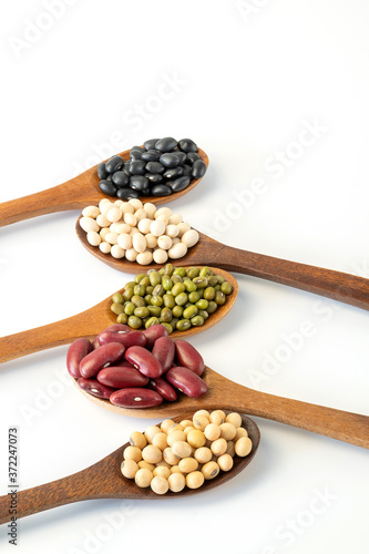 Collection of whole grains seeds isolated on white background. Healthy diet raw ingredients.
