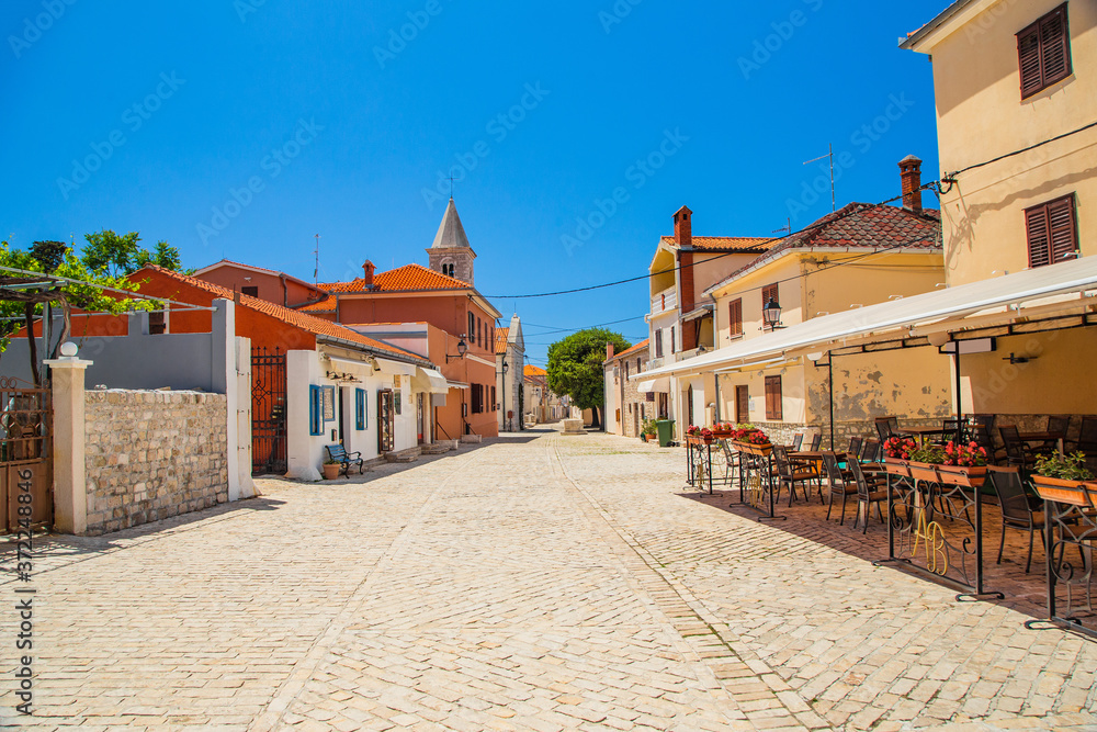 Cobbled square and old street in the historic town of Nin in Dalmatia, Croatia, tourist destination