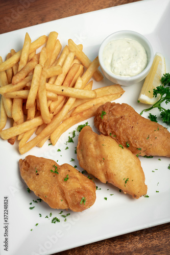 british traditional fish and chips meal on plate