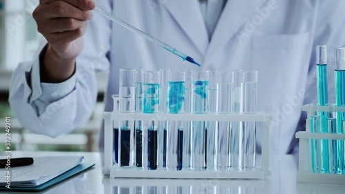Scientist test for Covid-19 or Corona virus By using science tubes to research and treat illness cancer in lab or hospital. Medical treatment concept