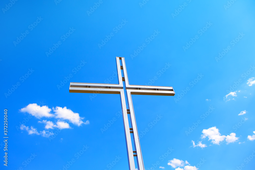 Religious Cross against blue sky Religious Cross against blue sky