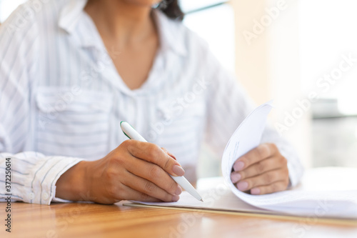 Business woman reading paper document in modern office