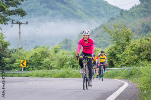 Cyclists in mountain. Biking travel tour on rural road at Suan Phueng district, Ratchaburi, Thailand.
