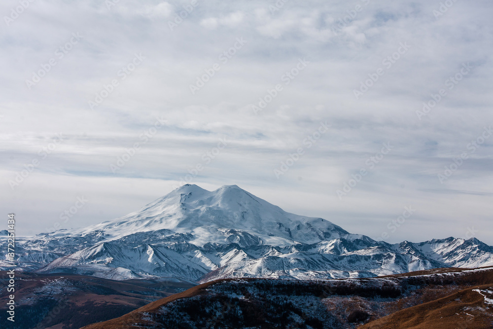 view of Elbrus from the North side in cloudy weather. mountain view in the snow