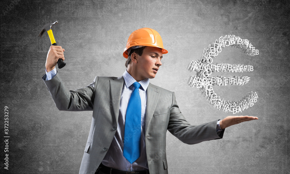 Businessman going to crash with hammer euro Businessman going to crash with hammer euro