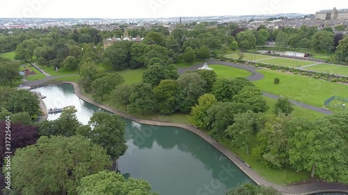 Aerial Drone of Lister Park in Bradford, Yorkshire. Trees, Band Stand and Pond