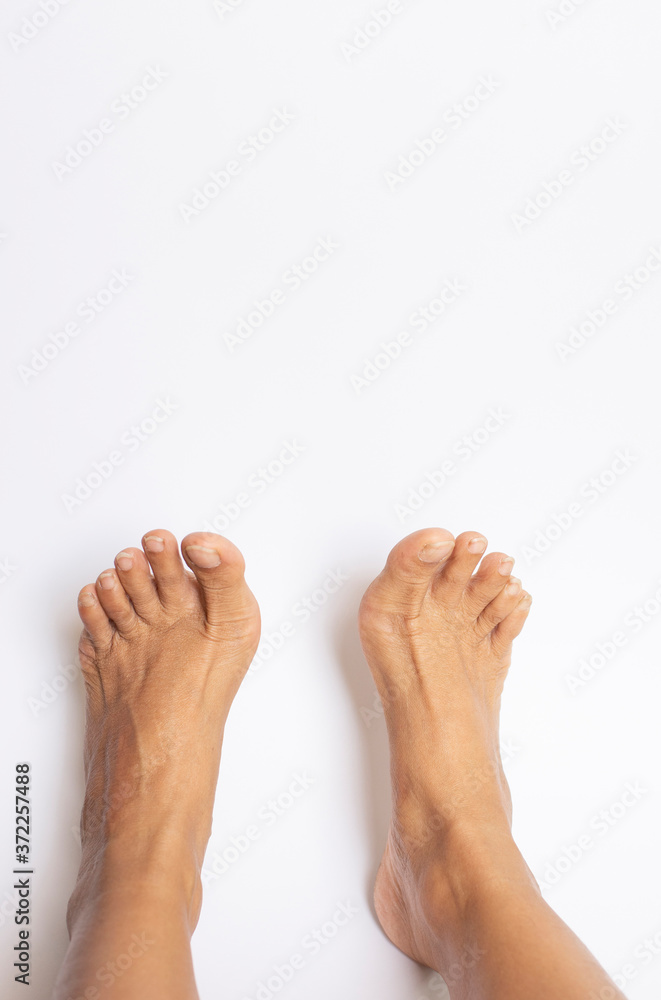 A person's bare feet on a white background A person's bare feet on a white background
