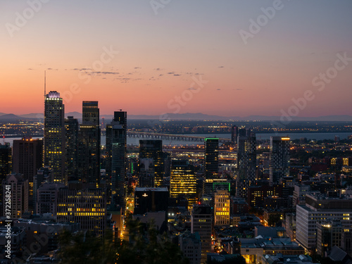 Montreal sunrise viewed from Mount Royal with city skyline in the morning