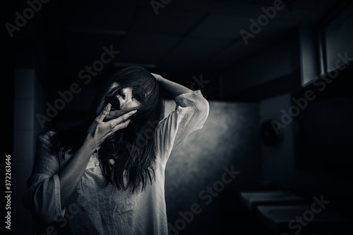 Portrait of asian woman make up ghost face,Horror scene,Scary background,Halloween poster