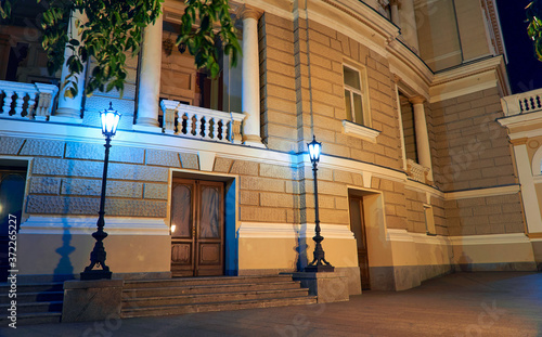 night view of Opera house in Odessa city, Ukraine. Beautiful city Park and street illumination
