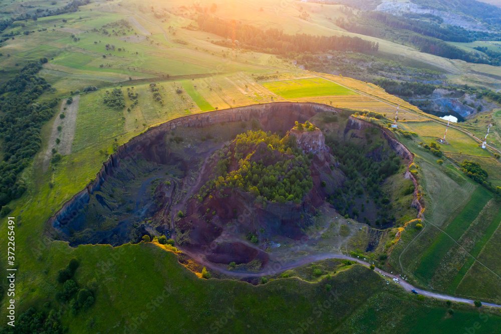 Volcanic crater of Racos village, Transylvania, Romania - drone view