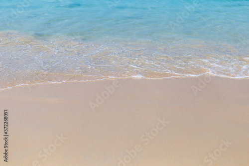 Clear sea water on clean sand beach background, summer outdoor day light, nature concept background, environmental
