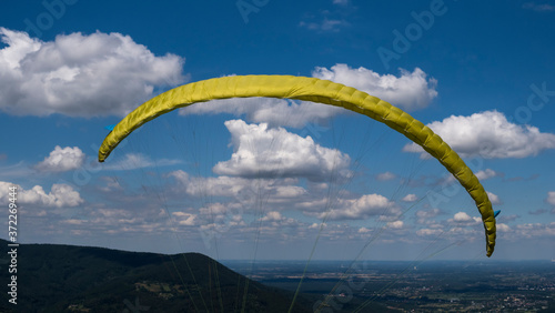 paraglider in a hillty terrain