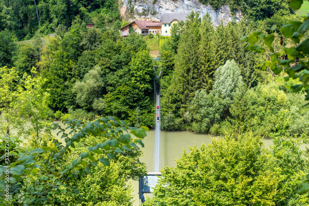 The suspension bridge in the village Grossraming is a major tourist attraction. The stress ribbon bridge leads across the river Enns in Upper Austria