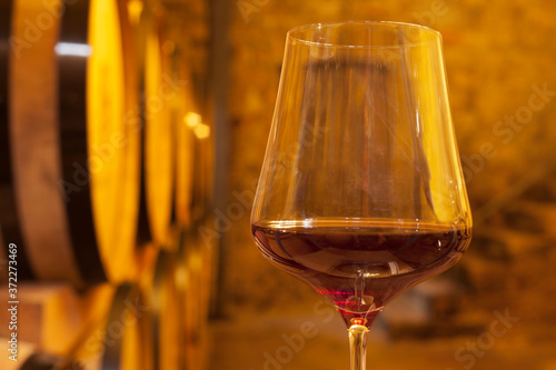 Bild auf Leinwand Close-up a glass with red wine in a wine cellar