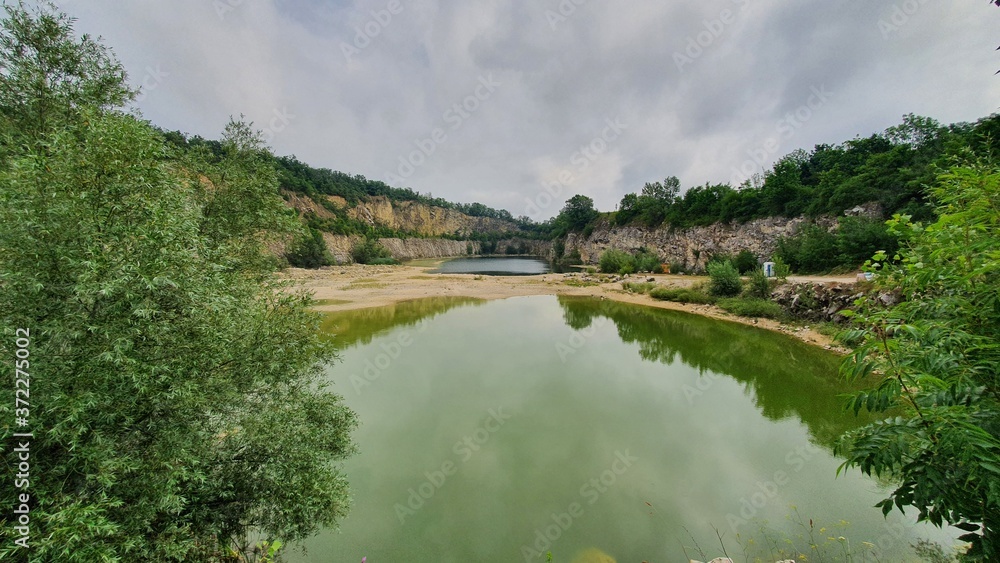 Fototapeta premium quarry lake in the forrest