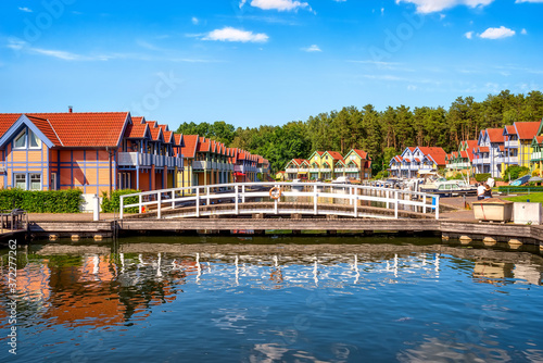 Harbor village Rheinsberg-Brandenburg with traditional houses on a sunny day in summer, Germany photo