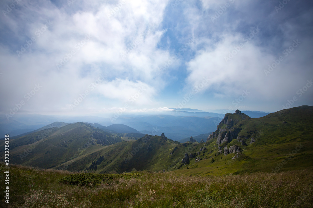 Fototapeta premium Most scenic mountain from Romania, Ciucas mountains in summer mist.