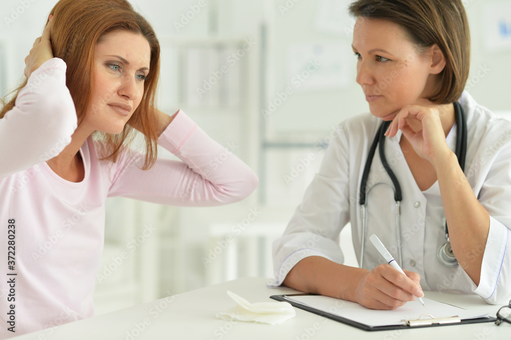 Portrait of woman in hospital with caring doctor Portrait of woman in hospital with caring doctor