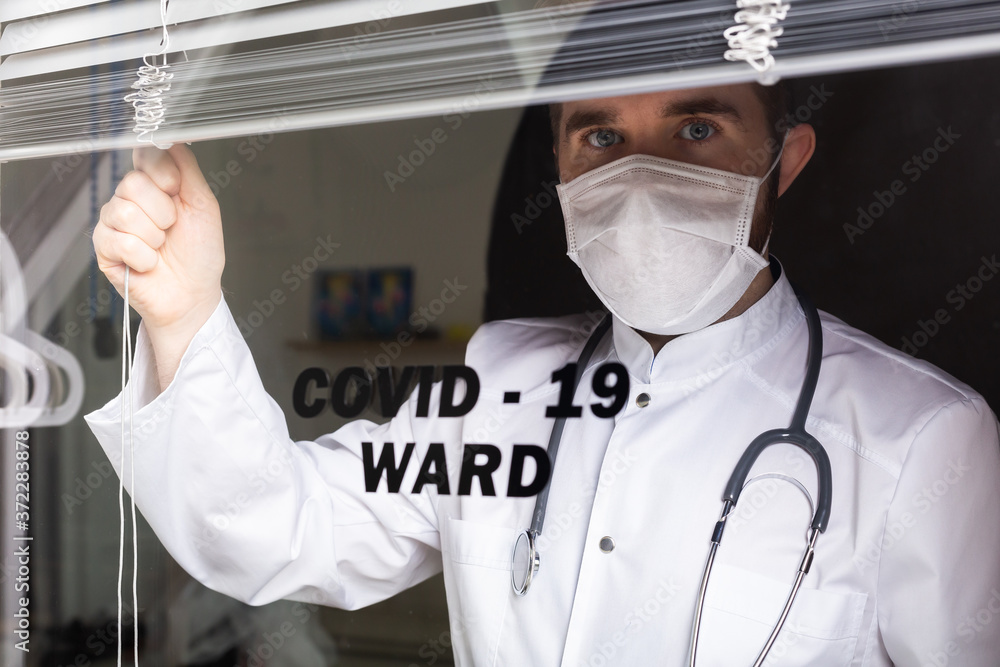 Medicine and health care concept. Man doctor in hospital. Doctor wearing protective mask checking and take care infected people from covid-19. Medicine and health care concept. Man doctor in hospital. Doctor wearing protective mask checking and take care infected people from covid-19.
