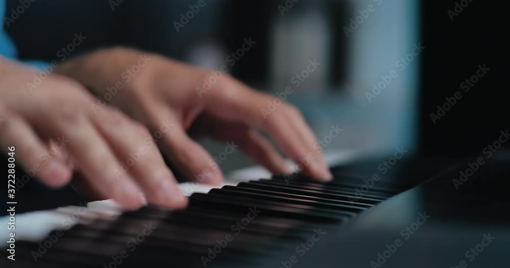 Close up of Fingers, Hands are playing digital electronic Piano Synthesizer. Playing on electronic piano keyboard. Concept: hobby, musician, making Music. Close up of Fingers, Hands are playing digital electronic Piano Synthesizer. Playing on electronic piano keyboard. Concept: hobby, musician, making Music.
