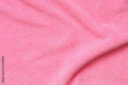 Pink towel fabric texture surface close up background © Piman Khrutmuang
