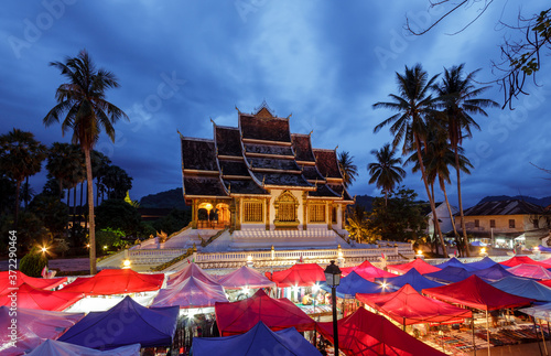Wat Xieng Thong temple and night market in Luang Prabang, Laos © Anton