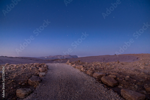 Footpath, Mount Ardon, and stars, in Makhtesh (crater) Ramon photo