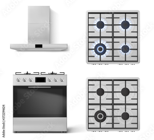 Slika na platnu Gas stove with oven and cooker hood in front view isolated on white background