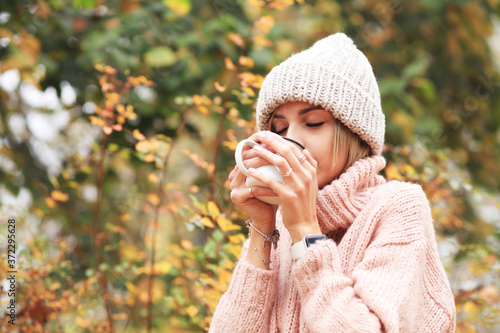 young woman with cup of hot tea 